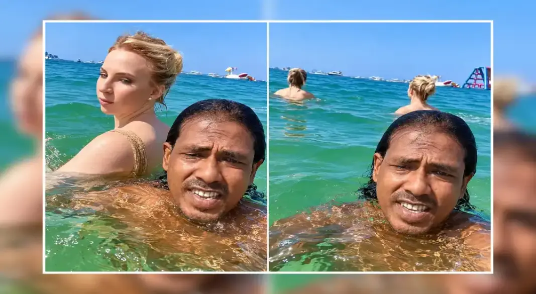 দুবাইয়ের সমুদ্রসৈকতে বিদেশি এক নারীর সঙ্গে সেলফিতে বাংলাদেশি প্রবাসী ইমরান হোসেন। ছবি: সংগৃহীত