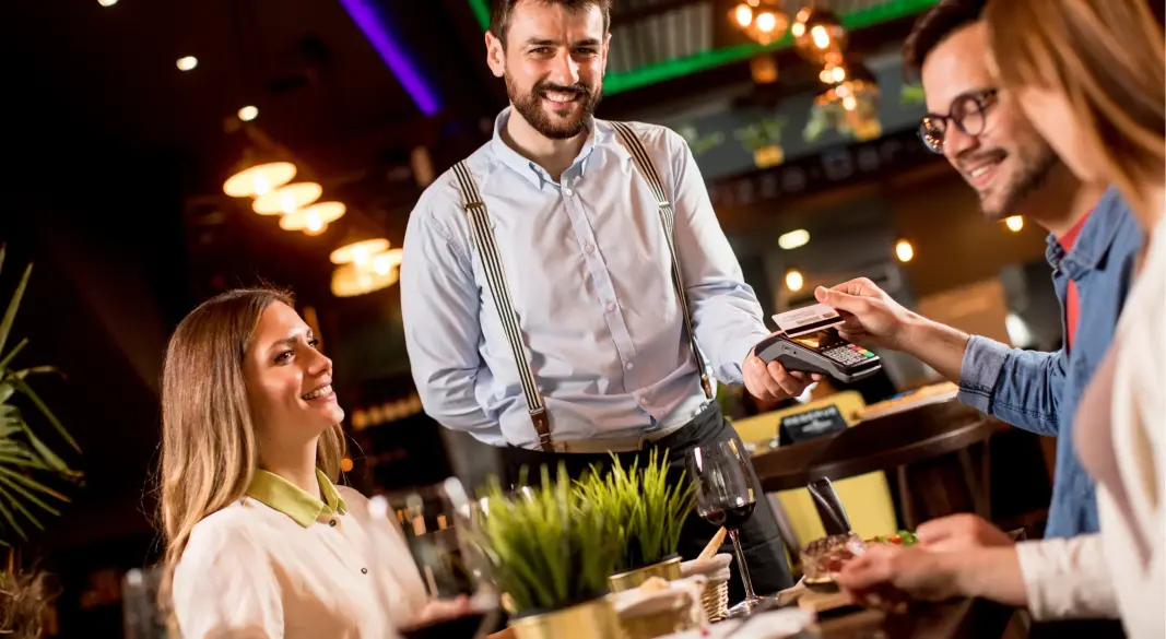young-man-paying-with-contactless-credit-card