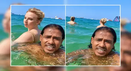 দুবাইয়ের সমুদ্রসৈকতে বিদেশি এক নারীর সঙ্গে সেলফিতে বাংলাদেশি প্রবাসী ইমরান হোসেন। ছবি: সংগৃহীত